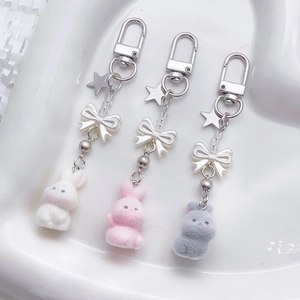 Plush bunny keychain set in white, pink, and grey with pearls and star pendants