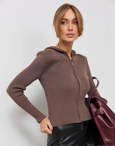 Detail of a brown ribbed knit hoodie featuring a metallic zipper and slim fit texture