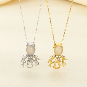 Detailed close-up of octopus pendant necklace featuring inlaid shell and sparkling crystals