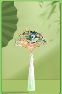 Detail of fan-shaped Hangzhou souvenir magnet featuring Leifeng Pagoda and silk tassels