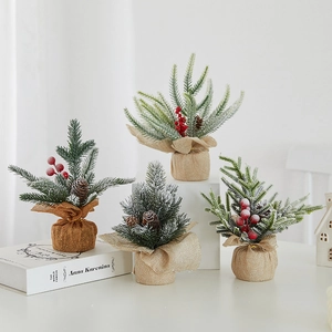 Mini PE Christmas trees with red berries and pine cones on a rustic burlap base