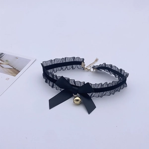 Close-up of black lace choker with satin bow and small golden bell for cat cosplay