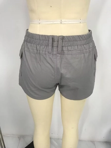 Detail view of the gray cargo denim shorts featuring an elastic waistband and back pockets