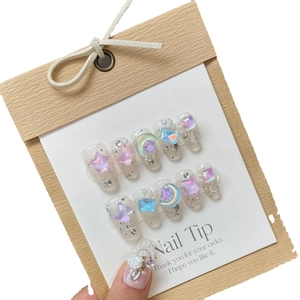 Handmade press-on nails with ice-clear finish, colorful butterflies and star charms