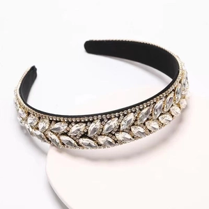 Detailed close-up of leaf-shaped marquise rhinestones on a wide baroque headband