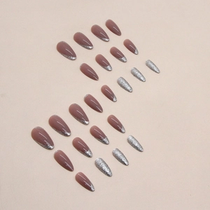 French tip almond press-on nails with silver glitter and dusty rose base color