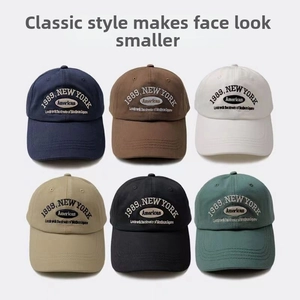 Detailed grid showing six assorted colors of vintage cotton baseball caps with embroidery