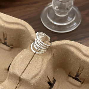 Minimalist S925 sterling silver multi-layer overlapping ring with a polished metallic finish