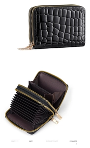 Detail of black crocodile texture card holder with double zipper and accordion slots