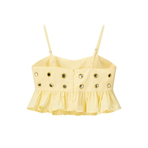 Détail du dos du caraco jaune clair avec fermeture éclair invisible et broderie miroir