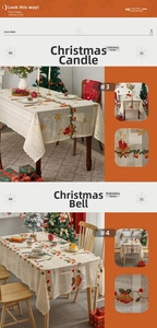 Detail of Christmas tablecloth with embroidery showing festive candle and bell patterns