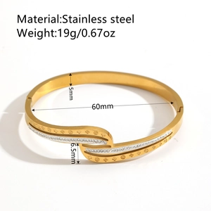 18K gold plated stainless steel bangle with twisted flower pattern and small crystals