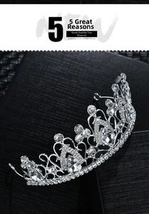 Close-up of silver bridal crown featuring teardrop crystals and heart-shaped filigree