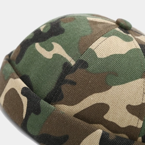 Close-up of jungle camouflage brimless dock hat featuring cotton twill texture and stitching