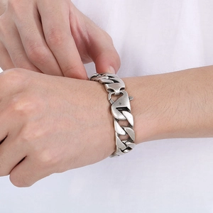 Detail of vintage matte Cuban chain bracelet featuring a heavy duty lobster clasp