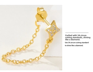 Macro shot of star stud earring with 5A grade zircon stones and gold chain link