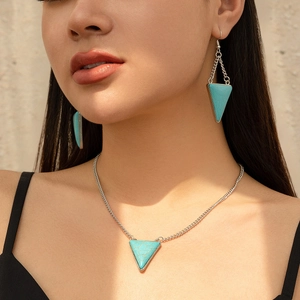 Bohemian style jewelry set featuring a turquoise triangle pendant necklace and matching earrings