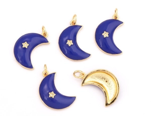 Detail showing blue enamel moon pendants with gold star accents and back texture