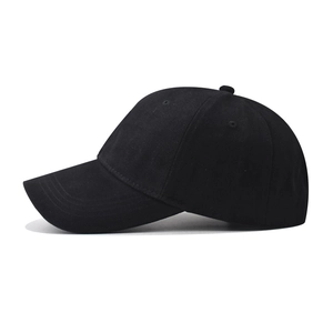 Side view of black cotton baseball cap showing curved brim and breathable eyelets