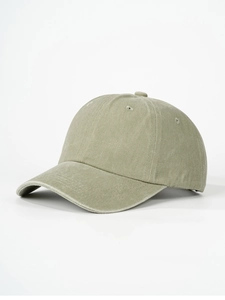 Detail view of washed cotton baseball cap with ventilation eyelets and curved brim
