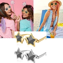 Detail of star-shaped kaleidoscope party sunglasses in gold and silver metal frames