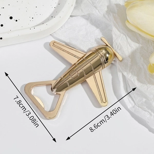 Golden airplane-shaped metal bottle opener with dimensions 7.8cm by 8.6cm on white background