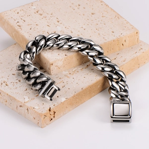 Heavy polished stainless steel Cuban link bracelet with square box clasp on stone