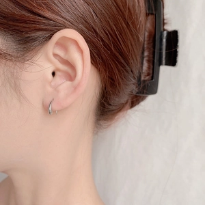 Minimalist S925 sterling silver water drop earrings shown on model ear for women