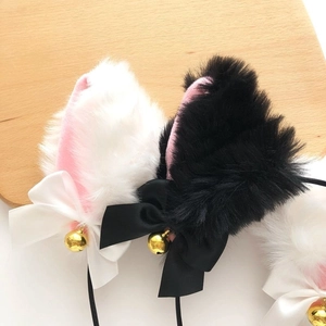 Plush cat ears headband with pink inner faux fur, satin bows, and golden bells