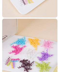 Detailed view of colorful spiral polymer clay chocolate rolls for DIY dessert decoration