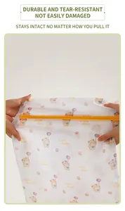 Detailed view of the durable mesh laundry bag showing its high elasticity and bear print
