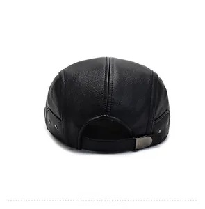 Detail view of the back of a black faux leather newsboy cap with an adjustable metal buckle
