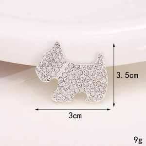 Detailed size view of silver dog brooch with white crystals: 3.5cm height and 3cm width