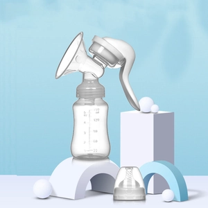 Manual breast pump set with 150ml 5oz graduated baby bottle on minimalist blue background