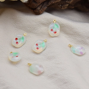 Handmade oval resin cherry flower pendants with golden metal loops for DIY jewelry making