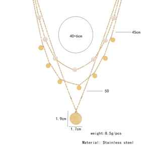 Detail view of layered stainless steel coin necklace with pearl charms and size dimensions
