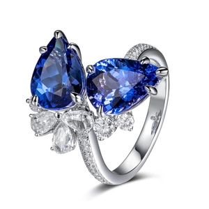Elegant silver open ring featuring dual pear-cut blue tanzanite stones and diamond accents