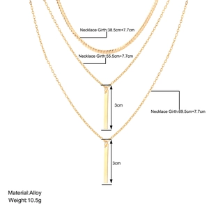 Three-layer gold necklace set with bar pendant and varying chain lengths for women