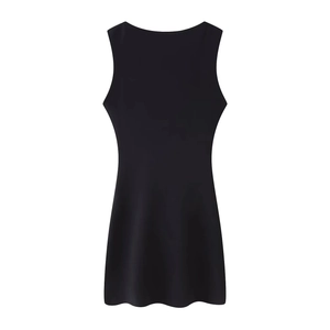 Detail view of a black sleeveless slim fit mini dress with elegant ruched textures