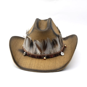 Detailed close-up of natural feathers and ethnic beads on a straw cowboy hat