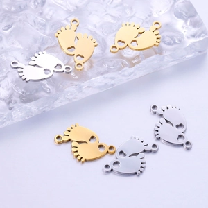 Detailed view of gold and silver baby feet charms made of polished stainless steel