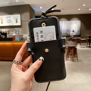 Detail of black leather iPhone case featuring a metal snap card slot and crossbody strap