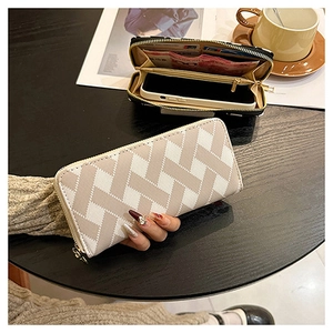 Detail view of woven long wallet interior featuring multiple card slots and phone pocket