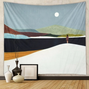 Close-up of bohemian wall tapestry featuring abstract Nordic mountain and moon scenery
