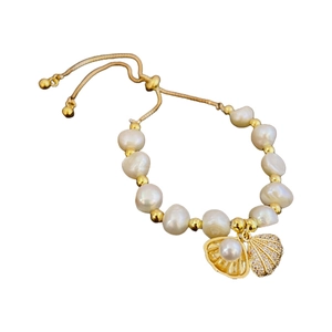 Elegant freshwater pearl bracelet with shell charms and adjustable gold chain