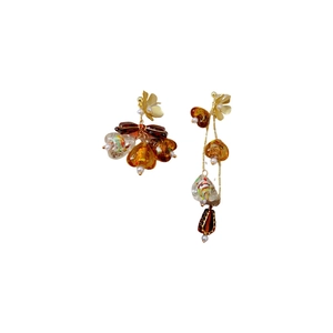 Asymmetric amber tassel earrings with vintage gold metal accents and pearl details