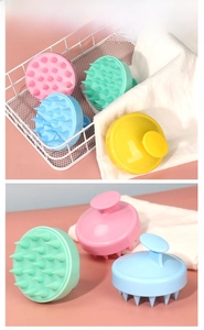 Detailed view of soft silicone scalp massage brushes in four pastel macaron colors