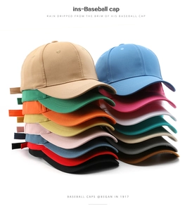 Collection of minimalist solid color baseball caps in fifteen different vibrant colors
