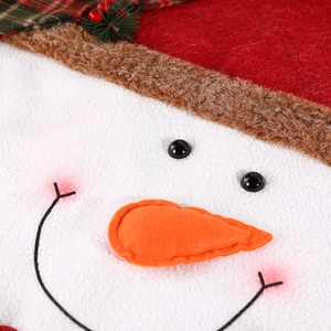 Detailed view of handmade snowman chair cover featuring red hat and plush fabric texture