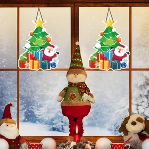 Christmas window decals and festive figurines including Santa and snowman on snowy window